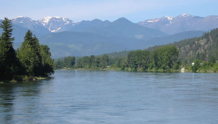 Kootenai River upstream from Libby, Montana with the Cabinet Range of the Rocky Mountains. Photo credit: Big Sky Fishing.Com